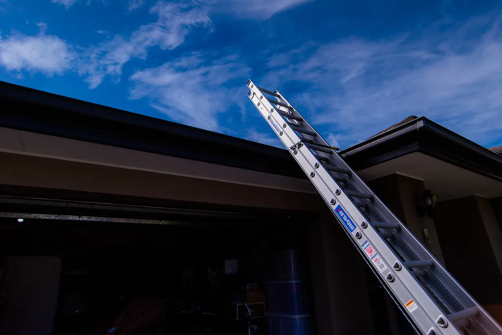 Extension ladder against house